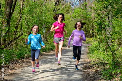 Family sport, happy active mother and kids jogging outdoors