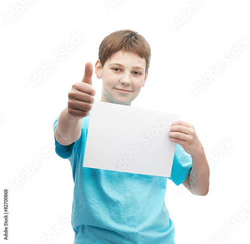 Happy young boy with a sheet of paper