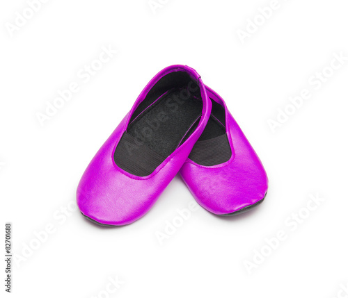 Childrens gym shoes isolated against a white background