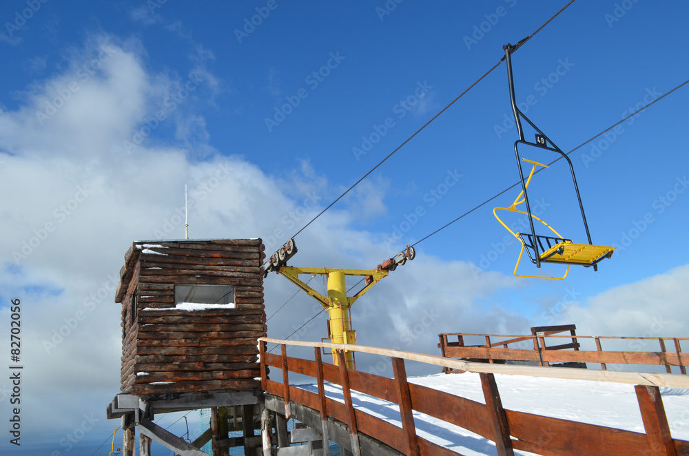 Cable lift with yellow chairs, ski slope Punta Arenas