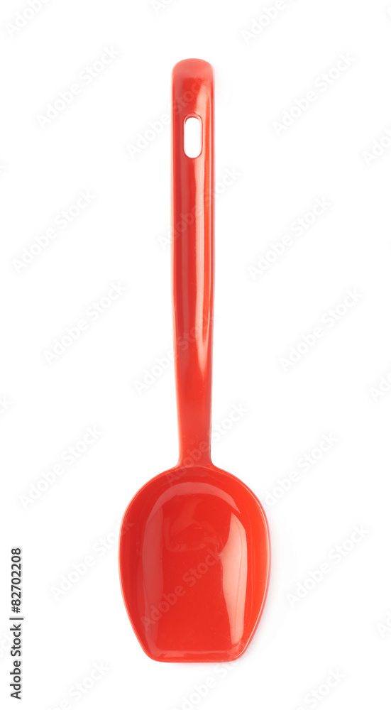 Red plastic kitchen scoop isolated Red plastic kitchen scoop isolated