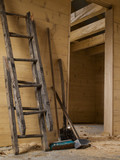 big hammer, broken wooden ladder, shovel and brush