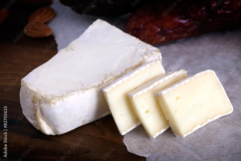 Detail view of fresh cheese cutting on slices