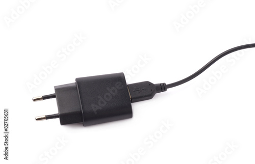 Fragment of the black adapter charger isolated