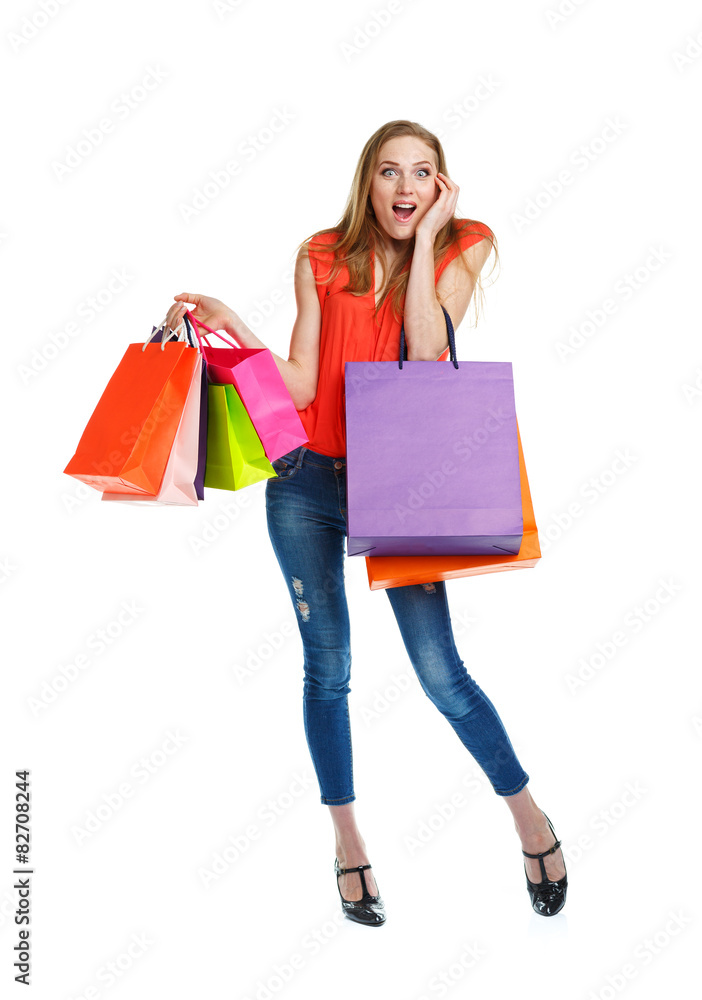 Happy lovely woman with shopping bags over white Happy lovely woman with shopping bags over white
