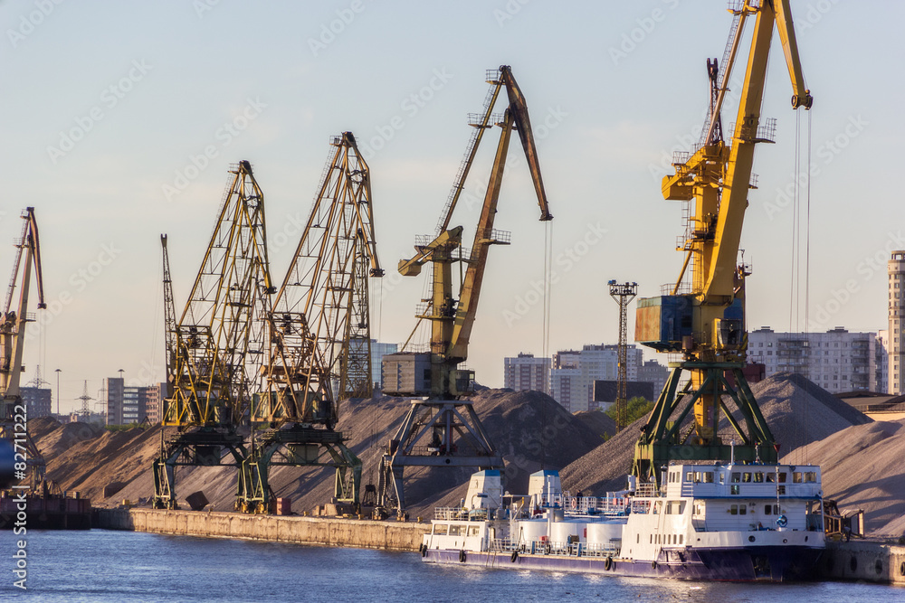 barges and cranes in river port