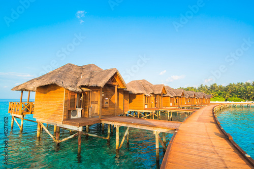 Over water bungalows with steps into amazing green lagoon