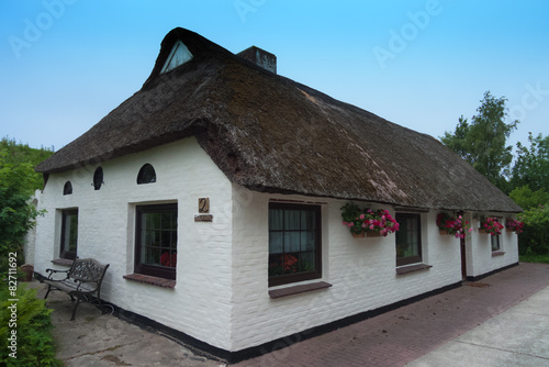 Architecture in North Frisia old white house with thatched roof