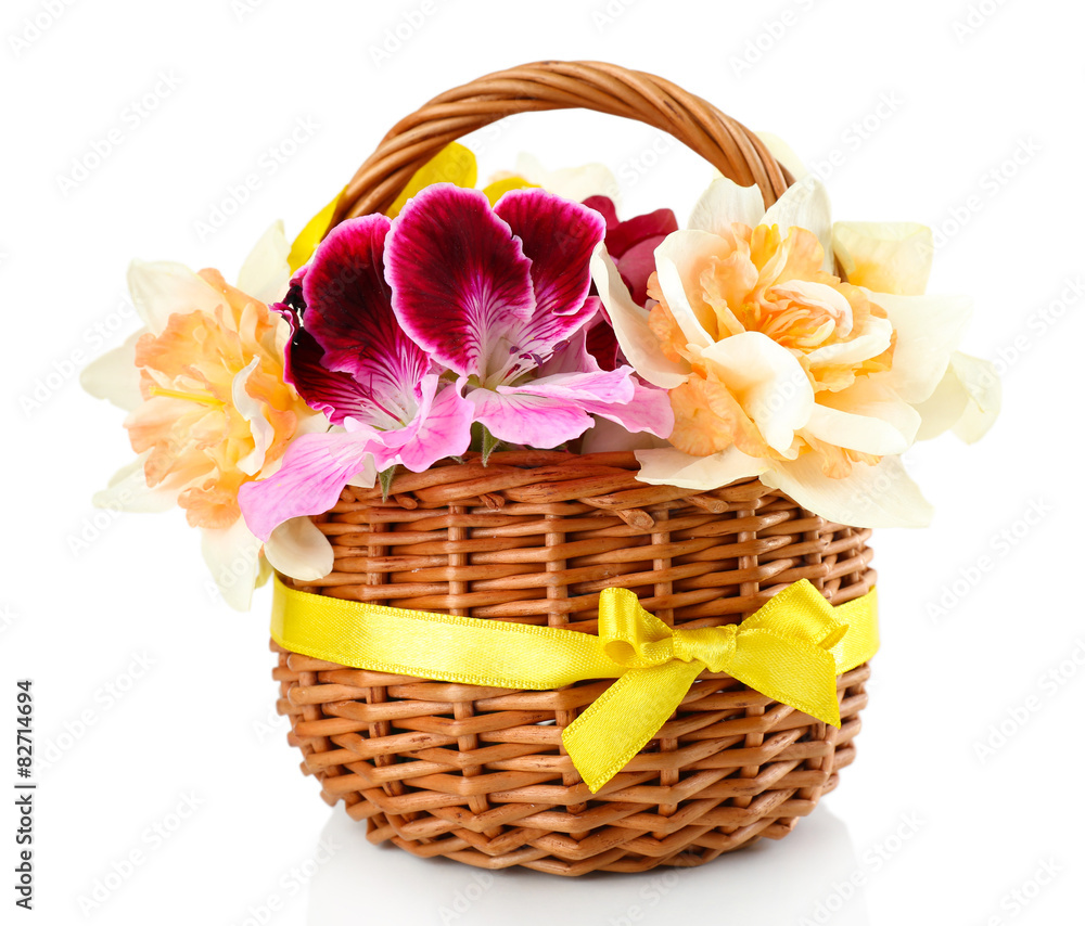 Beautiful flowers in basket isolated on white Beautiful flowers in basket isolated on white