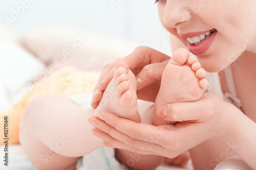 Mother and feet of a little baby 