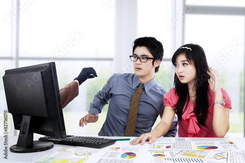 Photos Shocked businesspeople looking hacker 1