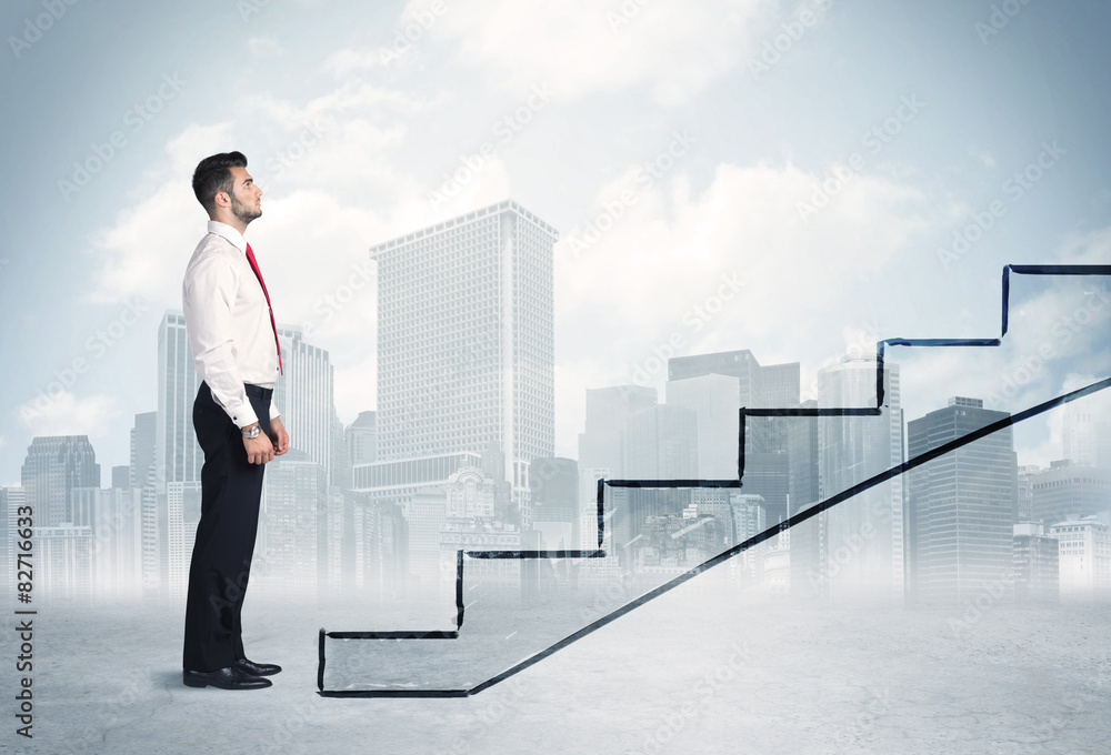 Business person in front of a staircase Business person in front of a staircase