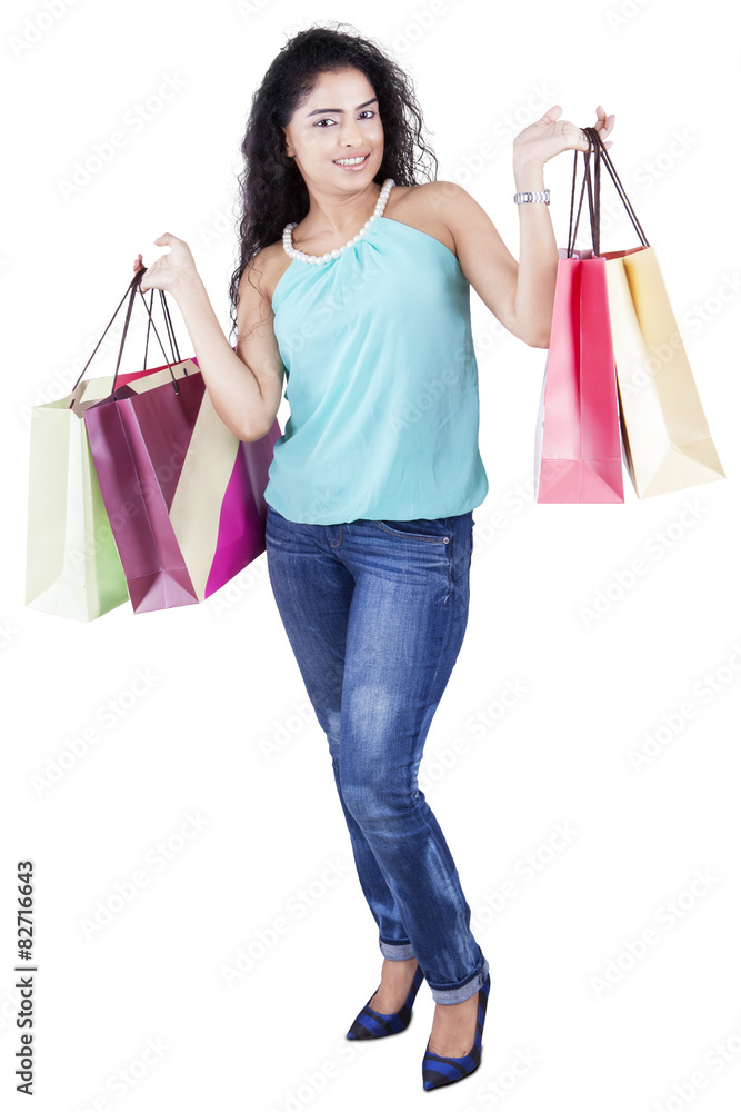 Model with curly hair and shopping bags