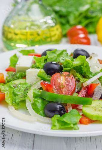 Greek salad on a white plate closeup