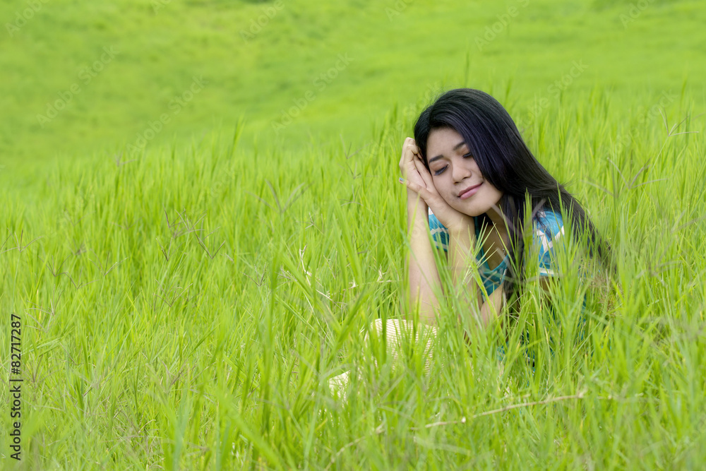 Lovely woman daydreaming at field Lovely woman daydreaming at field