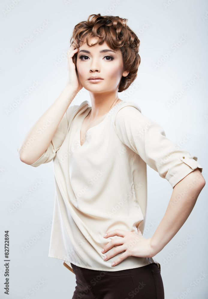 Fashion model woman posing in studio. Young model with short ha Fashion model woman posing in studio. Young model with short ha