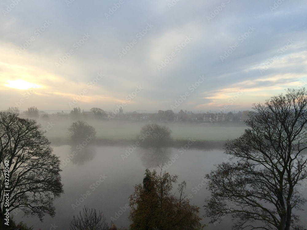 Sunrise through a foggy start of the day over the river Trent
