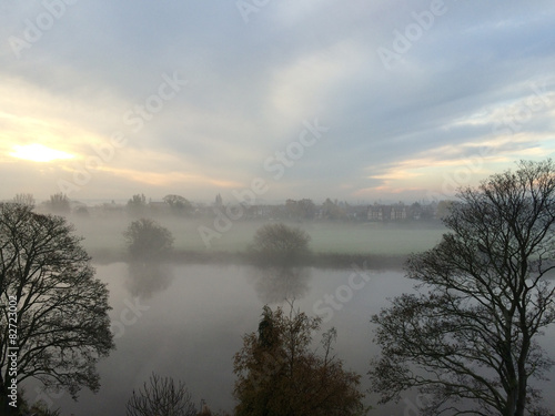 Sunrise through a foggy start of the day over the river Trent