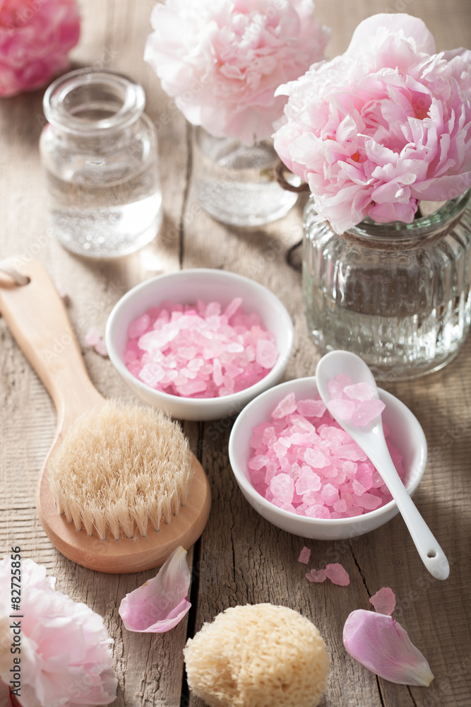 spa set with peony flowers and pink herbal salt