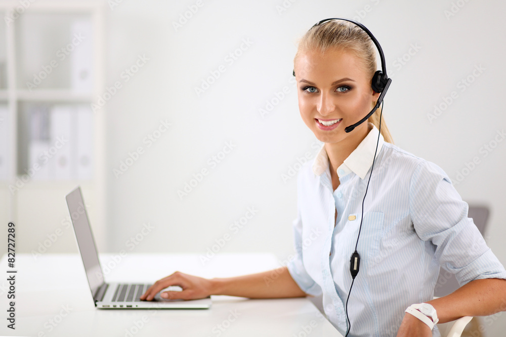 portrait of a customer service agent sitting at office portrait of a customer service agent sitting at office