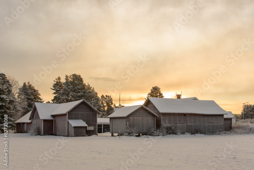 Group of old snowy farm houses © mbroms