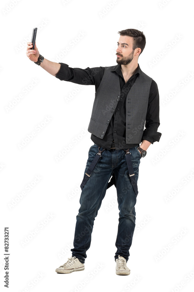 Trendy young man taking selfie photo with his mobile phone Trendy young man taking selfie photo with his mobile phone