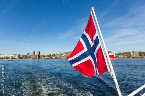 Norwegian flag waving on poop of a boat in Oslo
