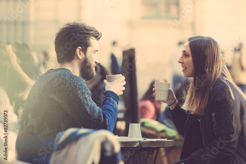 Canvas Print Hipster couple drinking coffee in Stockholm old town.