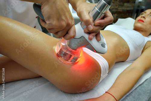 young woman during cosmetic body treatment