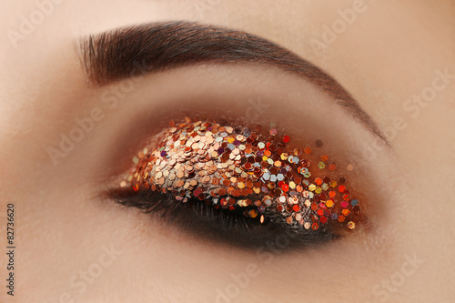 Female eye with fancy glitt...