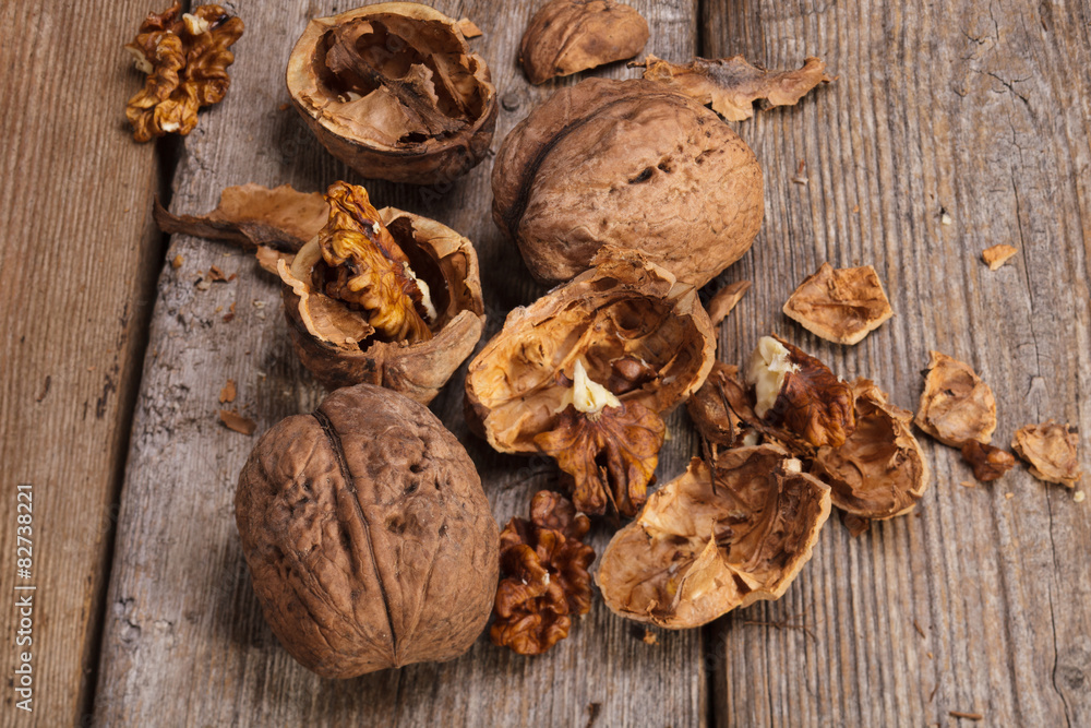 Raw Organic Walnuts on rustic old wooden table Raw Organic Walnuts on rustic old wooden table