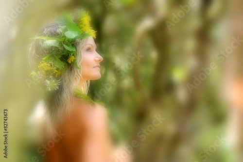 young woman portrait wearing wreath in summer