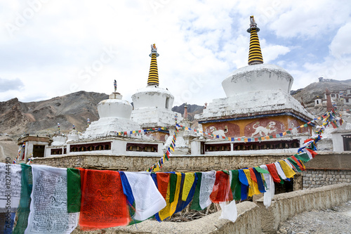 Buddhist stupa and prayer flags in Ladakh, India