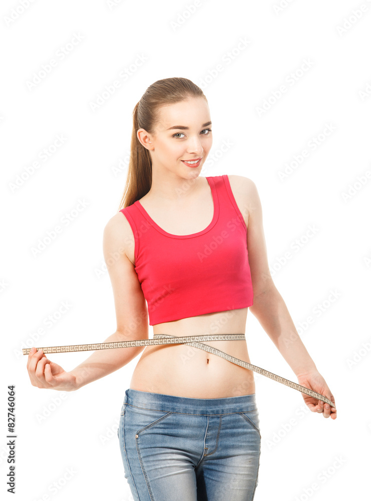 beautiful slender girl measures the waist isolated in white bac beautiful slender girl measures the waist isolated in white bac