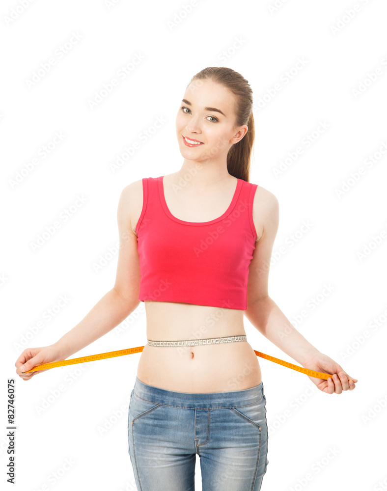 beautiful slender girl measures the waist isolated in white bac beautiful slender girl measures the waist isolated in white bac