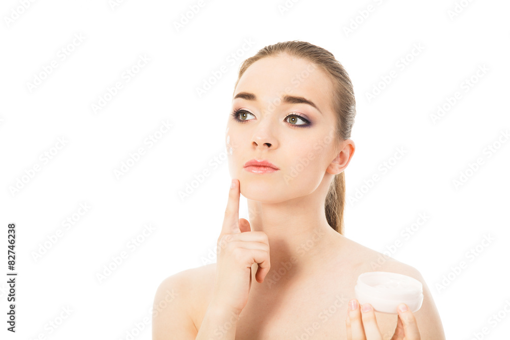 beautiful woman with face cream