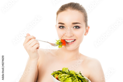 pretty woman eating salad