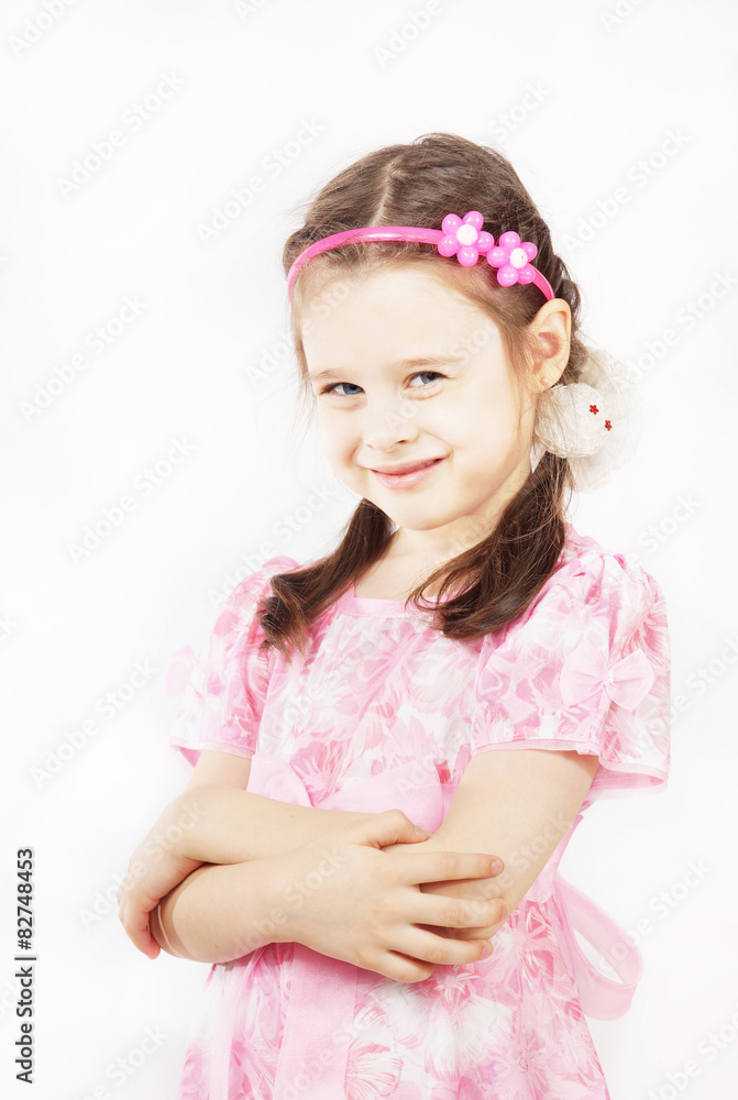 Little pretty girl wearing beautiful pink dress is smiling Little pretty girl wearing beautiful pink dress is smiling