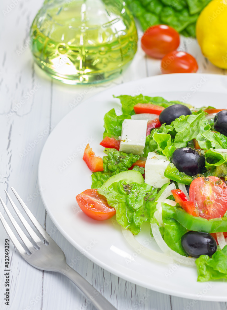 Greek salad on a white plate closeup