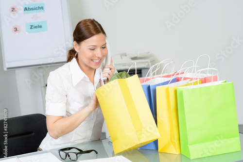businesswoman enjoy her purchase from online shopping