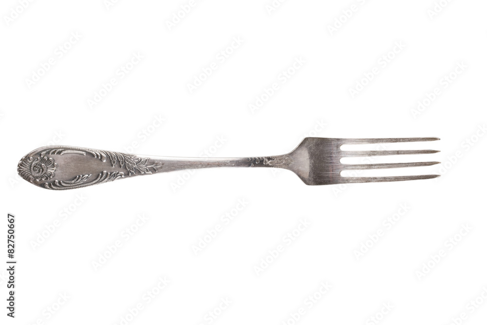 Old metal fork isolated on a white background