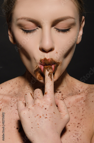 sexy woman with chocolate, finger in your mouth