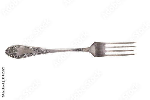 Old metal fork isolated on a white background