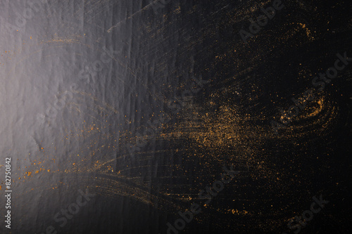 Traces of spices on black background. Selective focus. Culinary