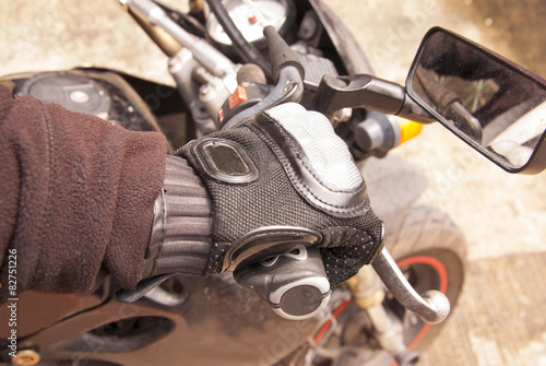  Biker hand rests on the steering wheel motorcycle