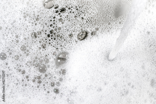 water washing foam in the kitchen sink photo