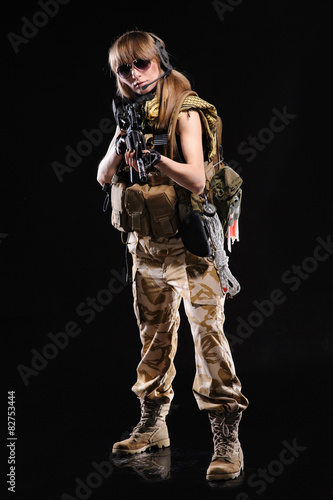 Beautiful army girl with gun