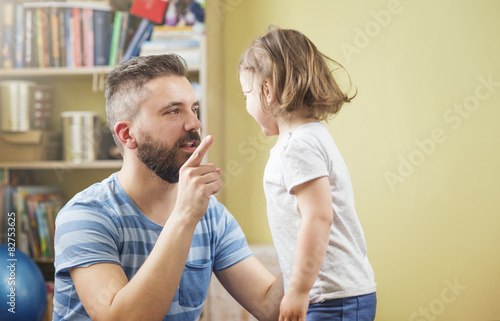 Young father with his cute little daughter photo