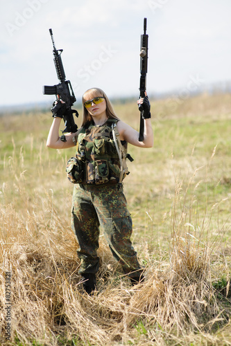 Beautiful army girl with guns