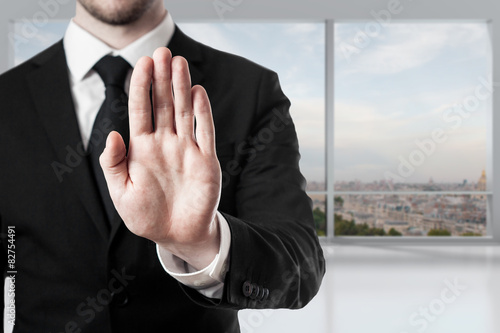 businessman in office hand stop gesture